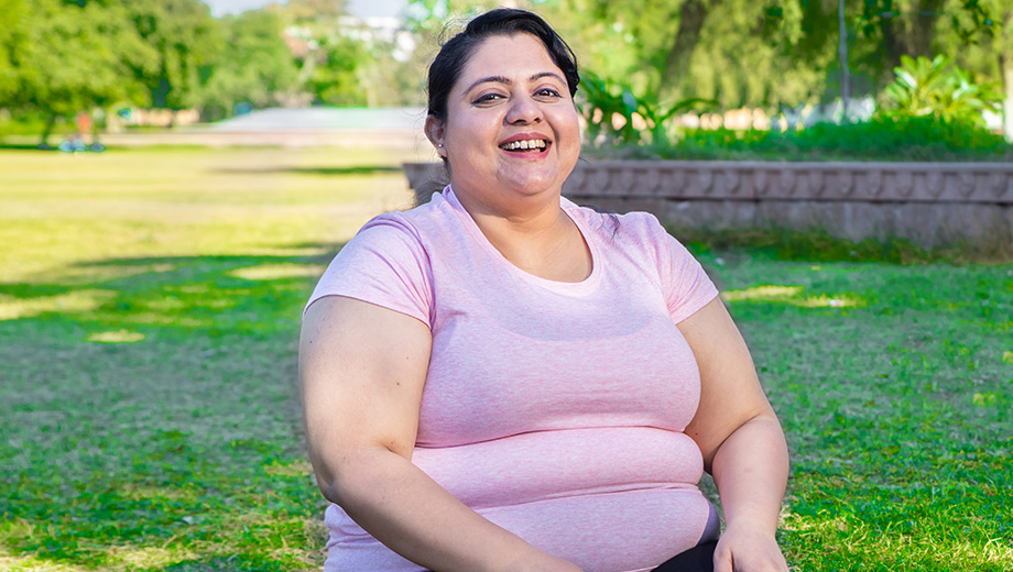 woman sitting on a bench, smiling