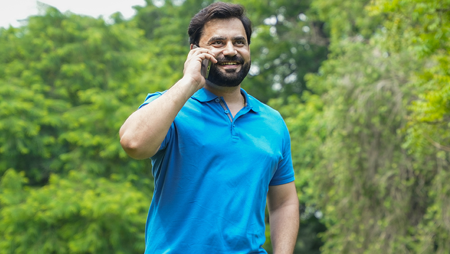 Man outside talking on phone.