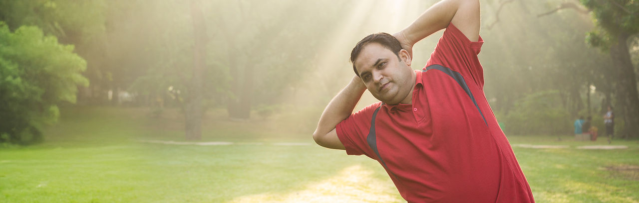 Man exercising in a park.